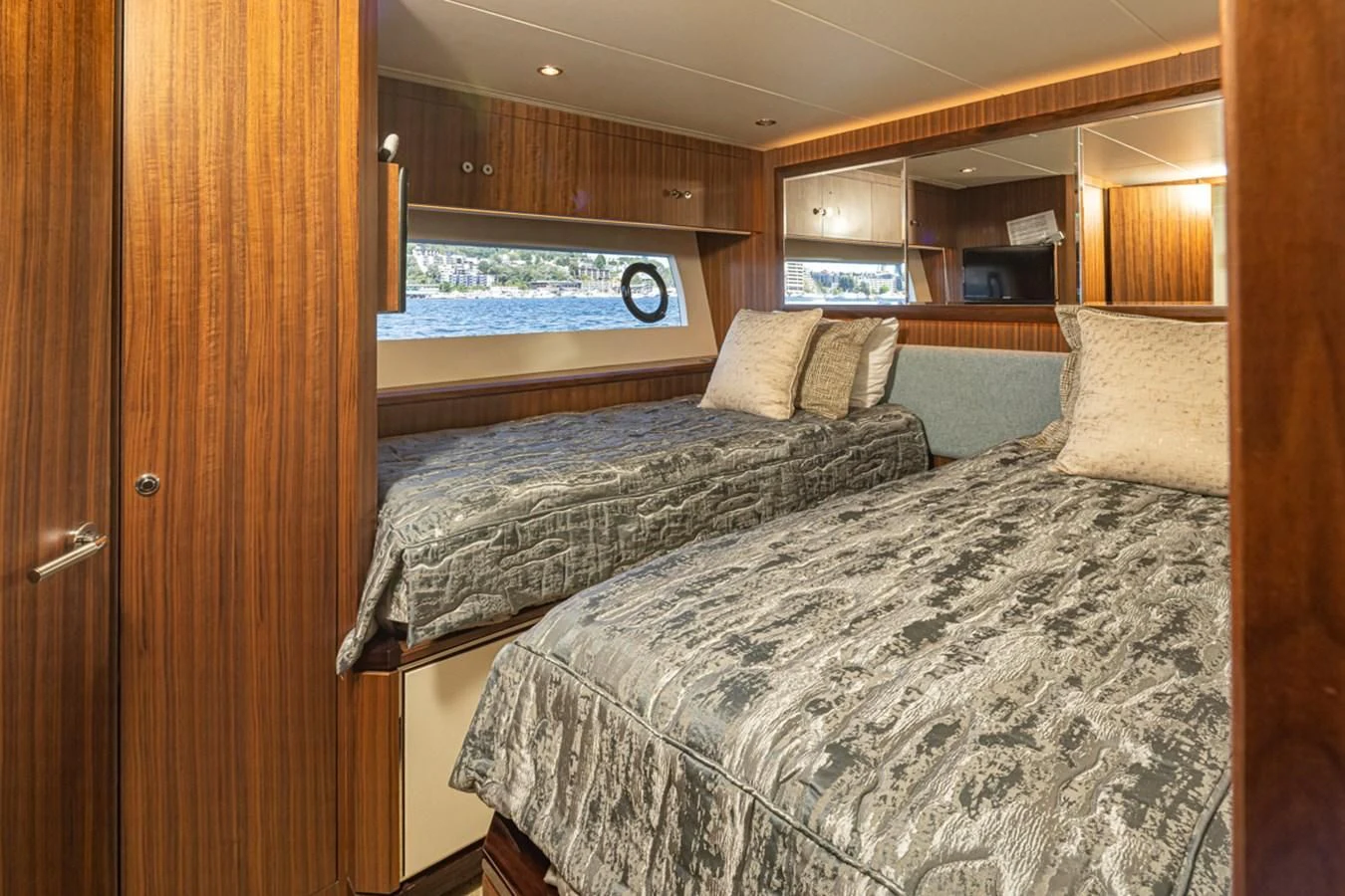 a couple of beds in a room aboard HYAK Yacht for Sale