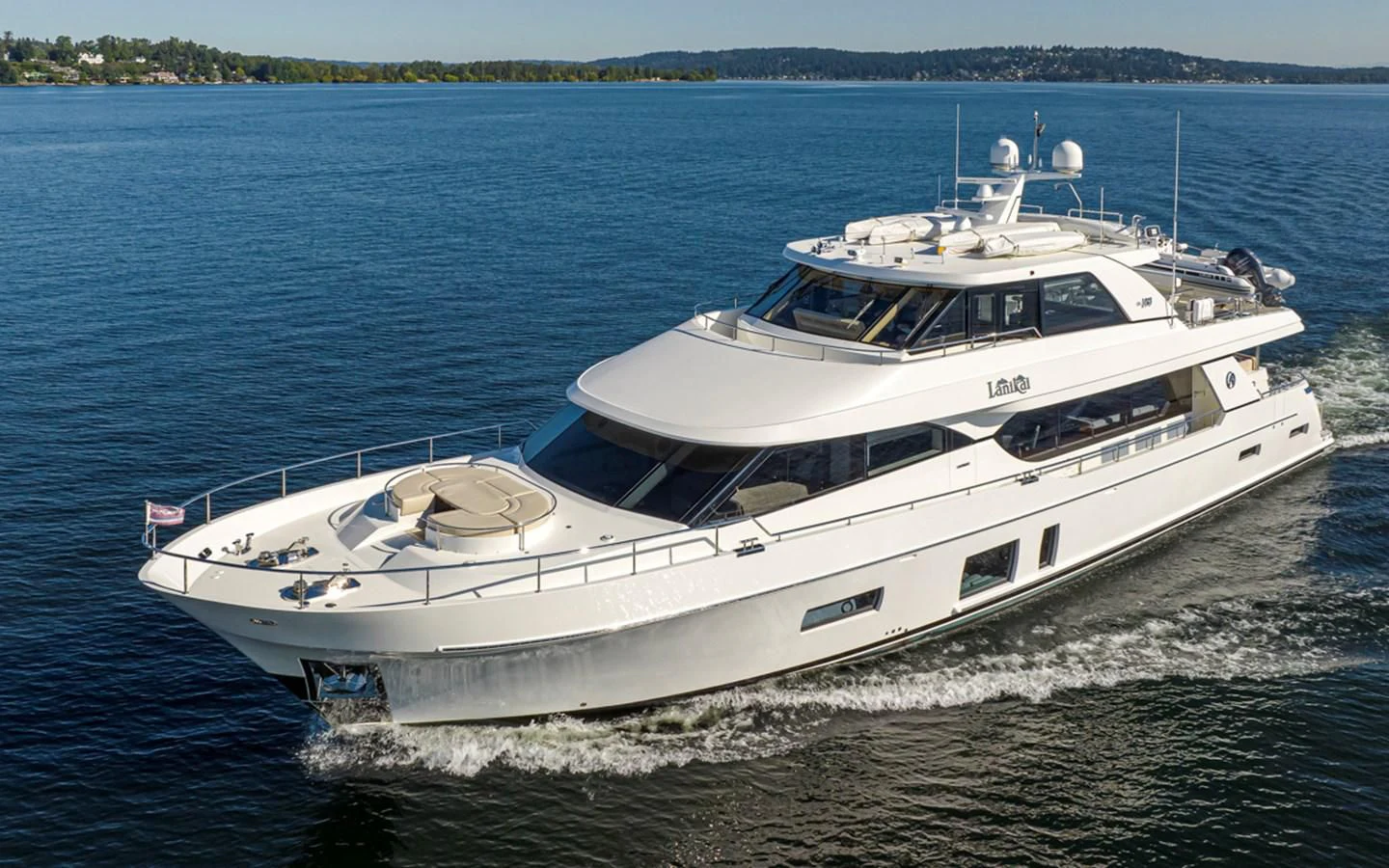 a white yacht on the water aboard HYAK Yacht for Sale