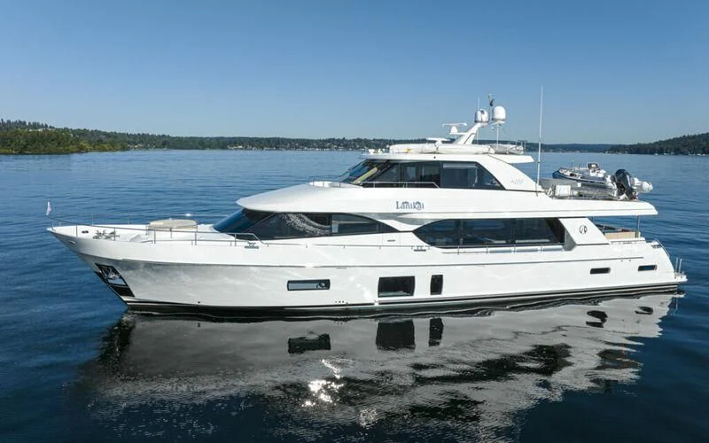 a white yacht on the water aboard HYAK Yacht for Sale