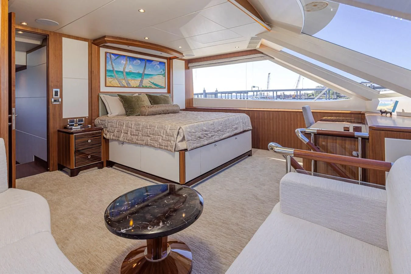 a large bedroom with a large bed aboard HYAK Yacht for Sale