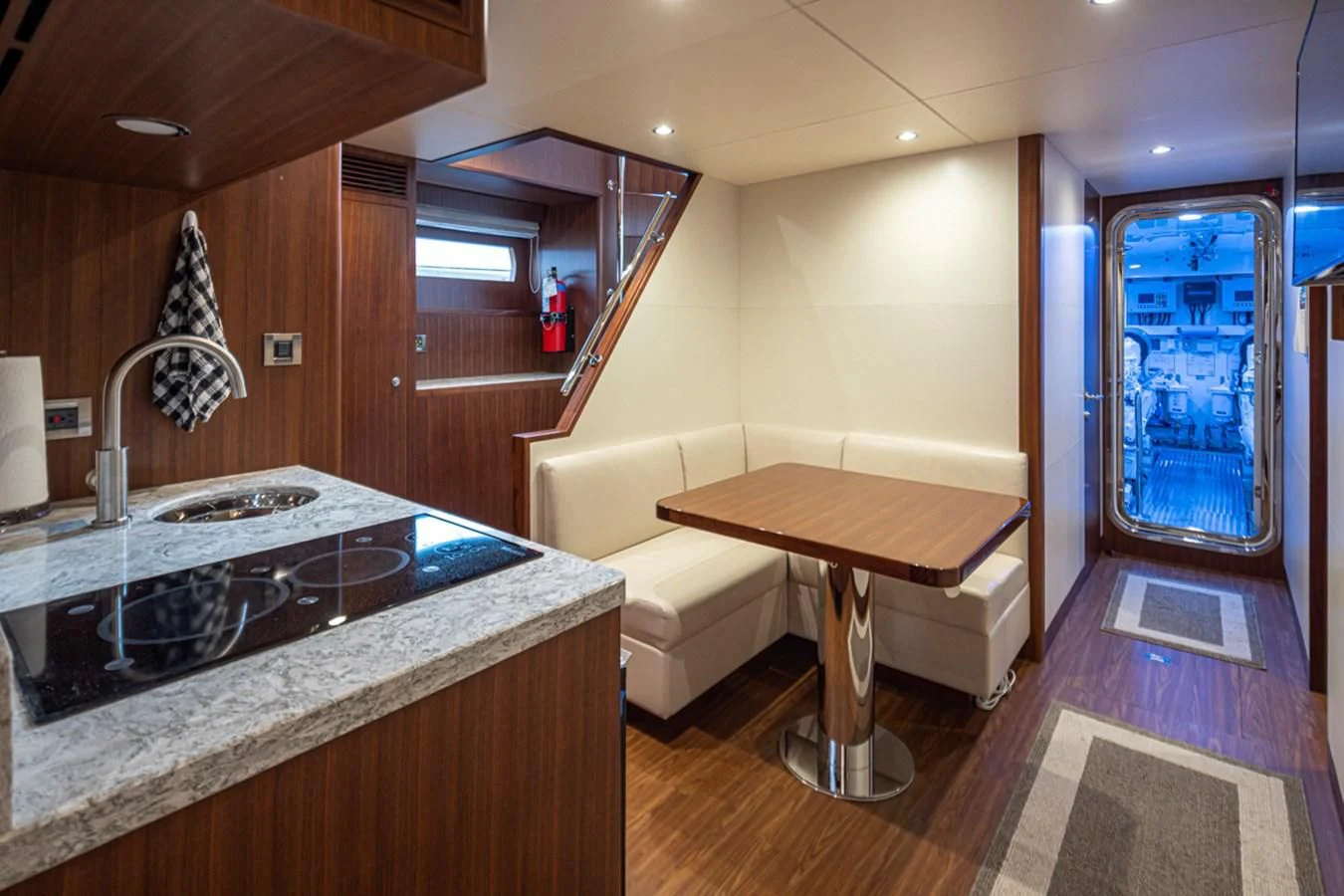 a kitchen with a sink and a table aboard HYAK Yacht for Sale