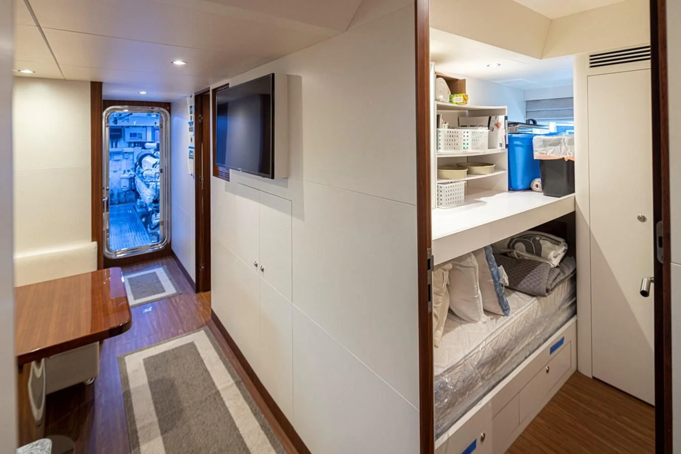 a room with a bed and a desk aboard HYAK Yacht for Sale