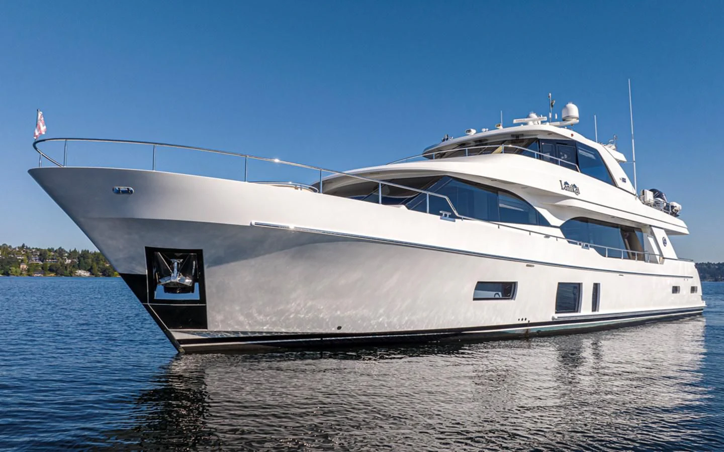 a large white boat on the water aboard HYAK Yacht for Sale
