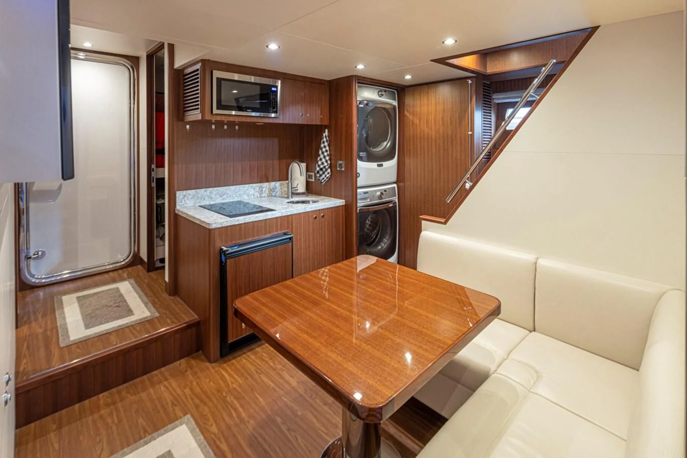a kitchen with a table and a microwave aboard HYAK Yacht for Sale