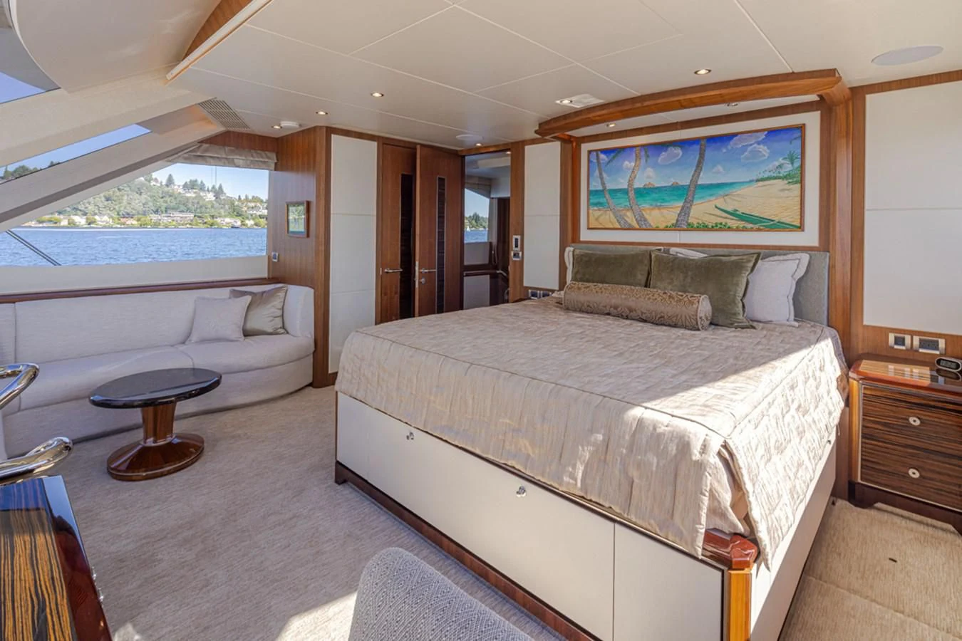 a large bedroom with a large bed aboard HYAK Yacht for Sale