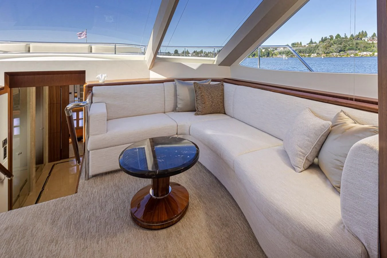 a couch and a table on a boat aboard HYAK Yacht for Sale