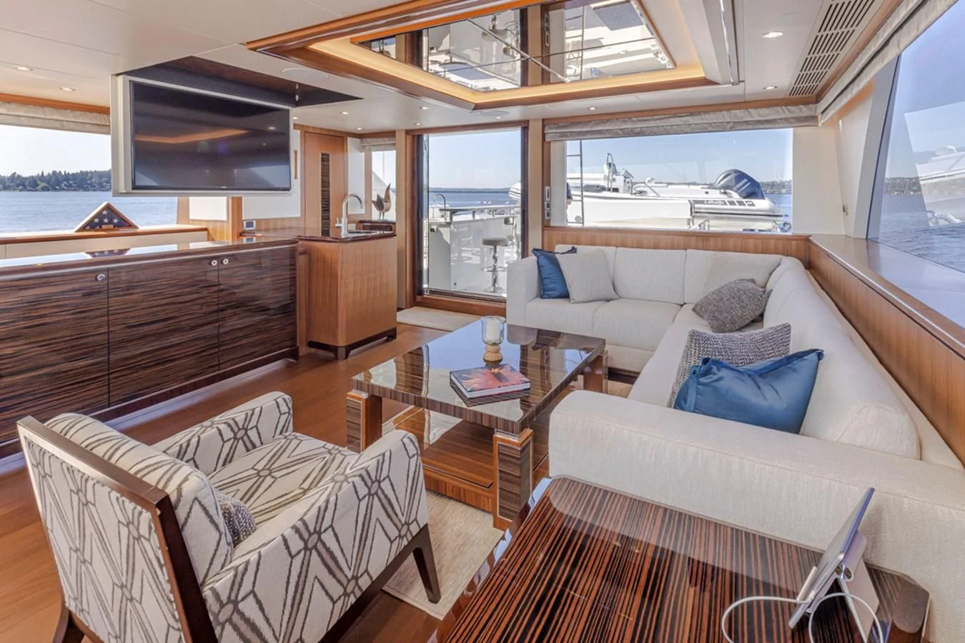 a living room with a couch and a coffee table aboard HYAK Yacht for Sale