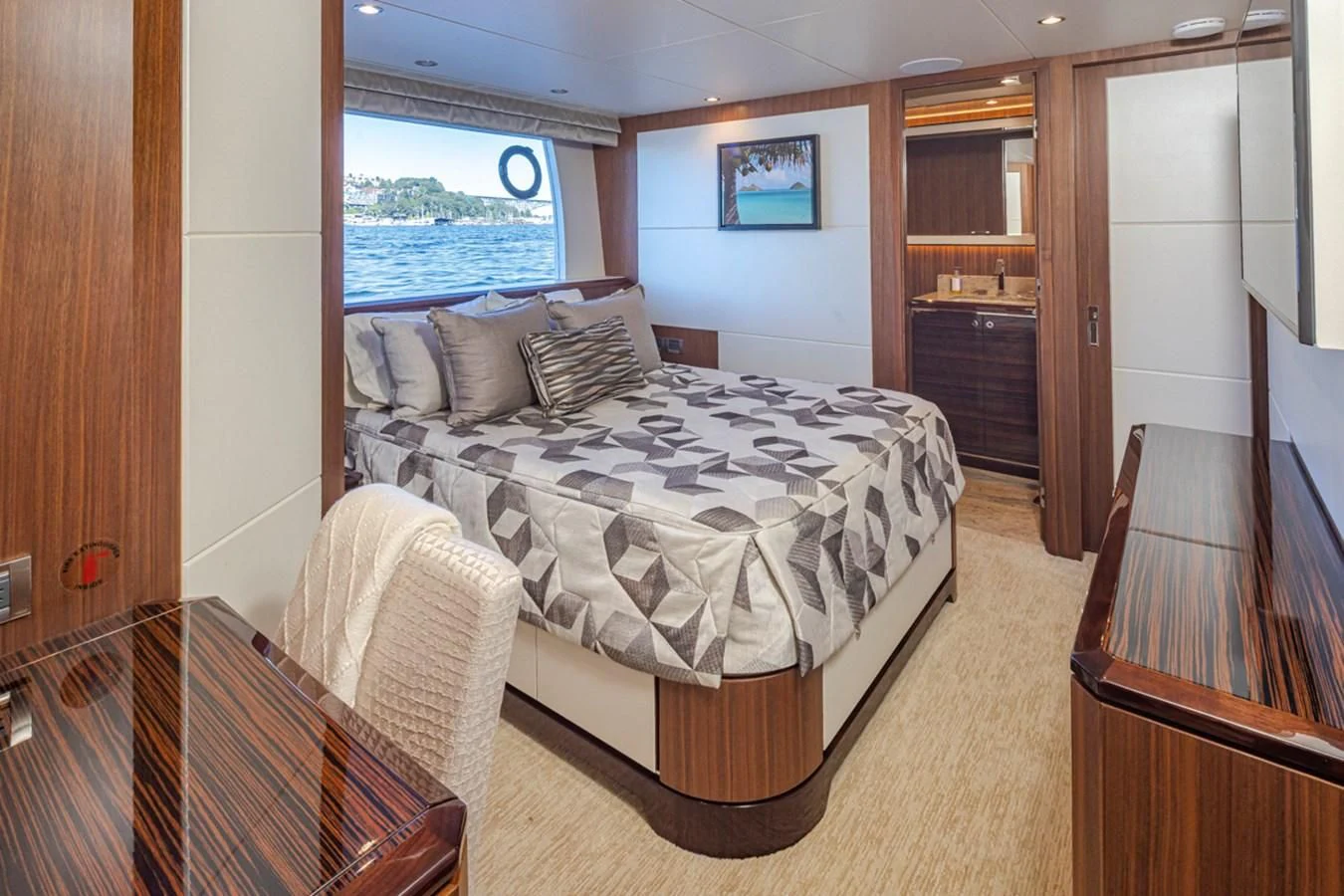 a bedroom with a large bed aboard HYAK Yacht for Sale
