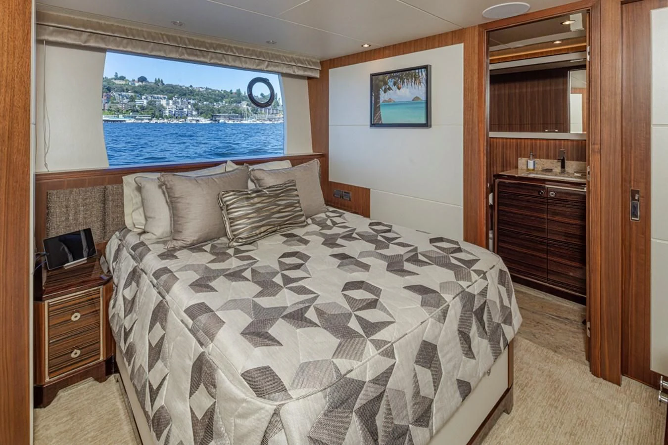 a bedroom with a large bed aboard HYAK Yacht for Sale
