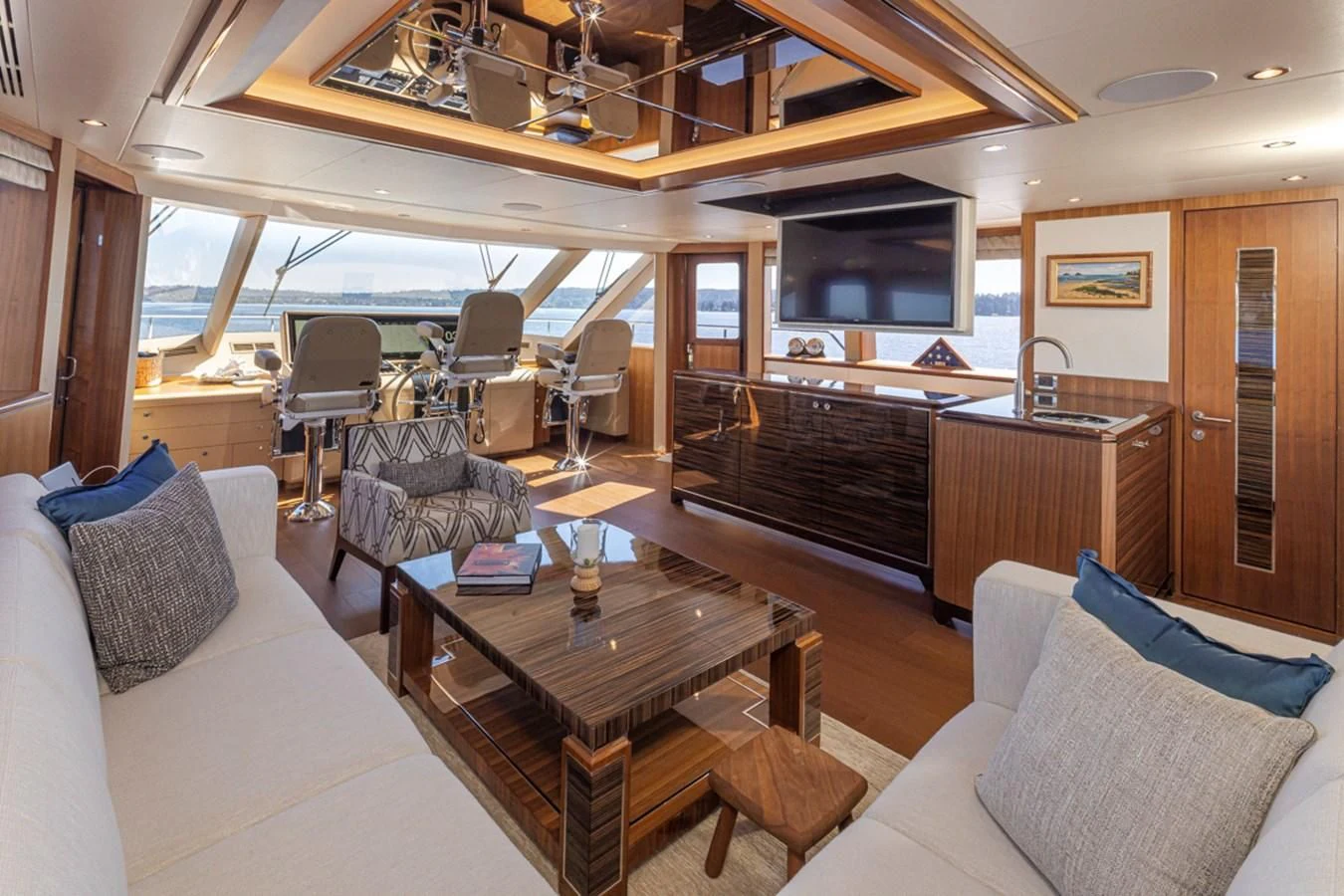 a living room with a piano aboard HYAK Yacht for Sale