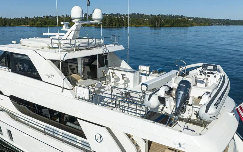 a boat with a motor attached to it aboard HYAK Yacht for Sale
