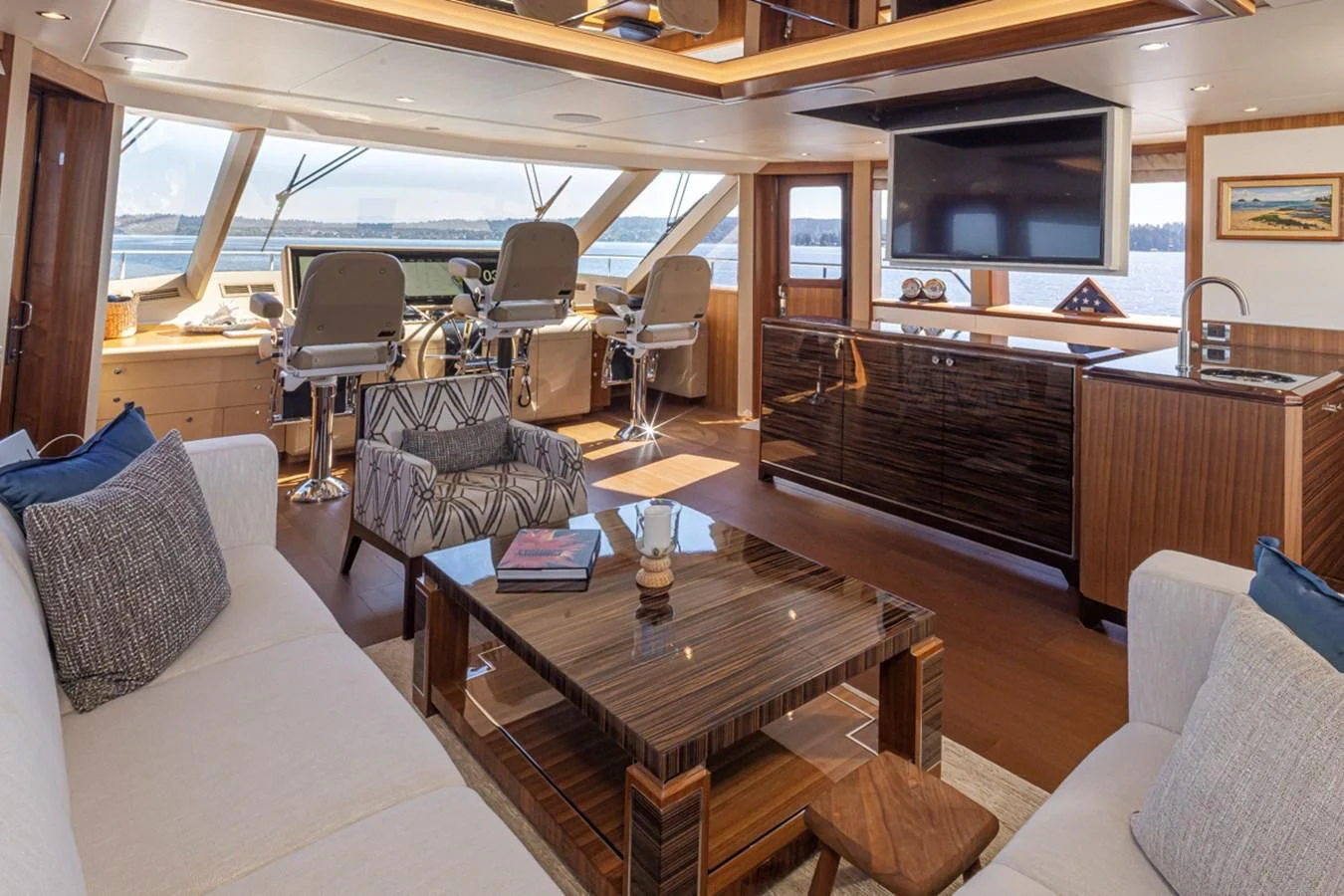 a living room with a piano aboard HYAK Yacht for Sale