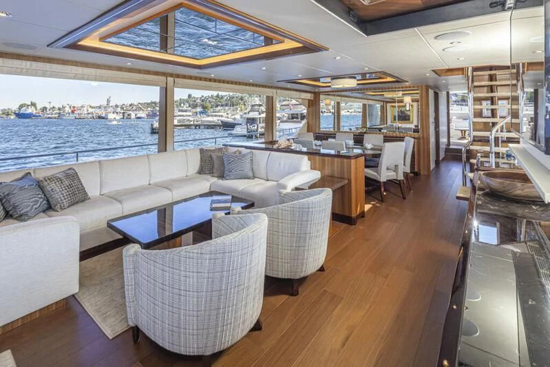 a living room with a large window aboard HYAK Yacht for Sale