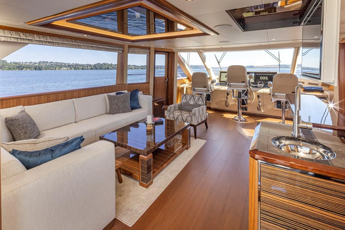 a boat with a couch and a table and chairs aboard HYAK Yacht for Sale