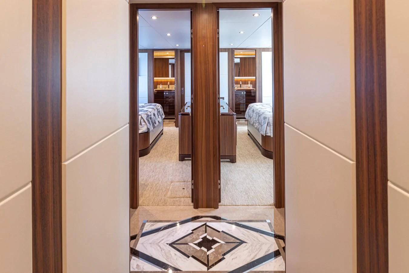 a hallway with a bed and a rug aboard HYAK Yacht for Sale