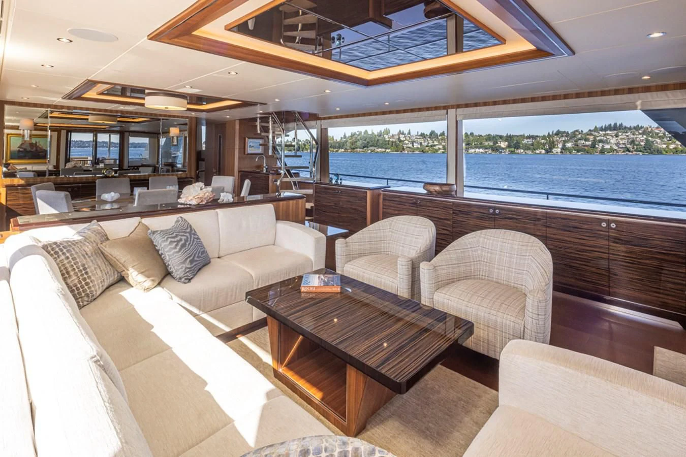 a living room with a large window aboard HYAK Yacht for Sale
