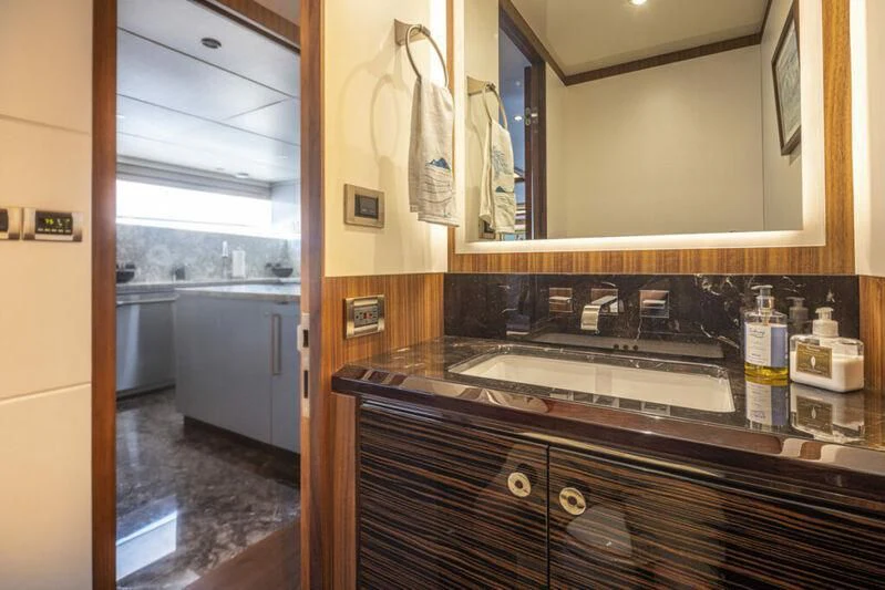 a kitchen with a sink and a window aboard HYAK Yacht for Sale