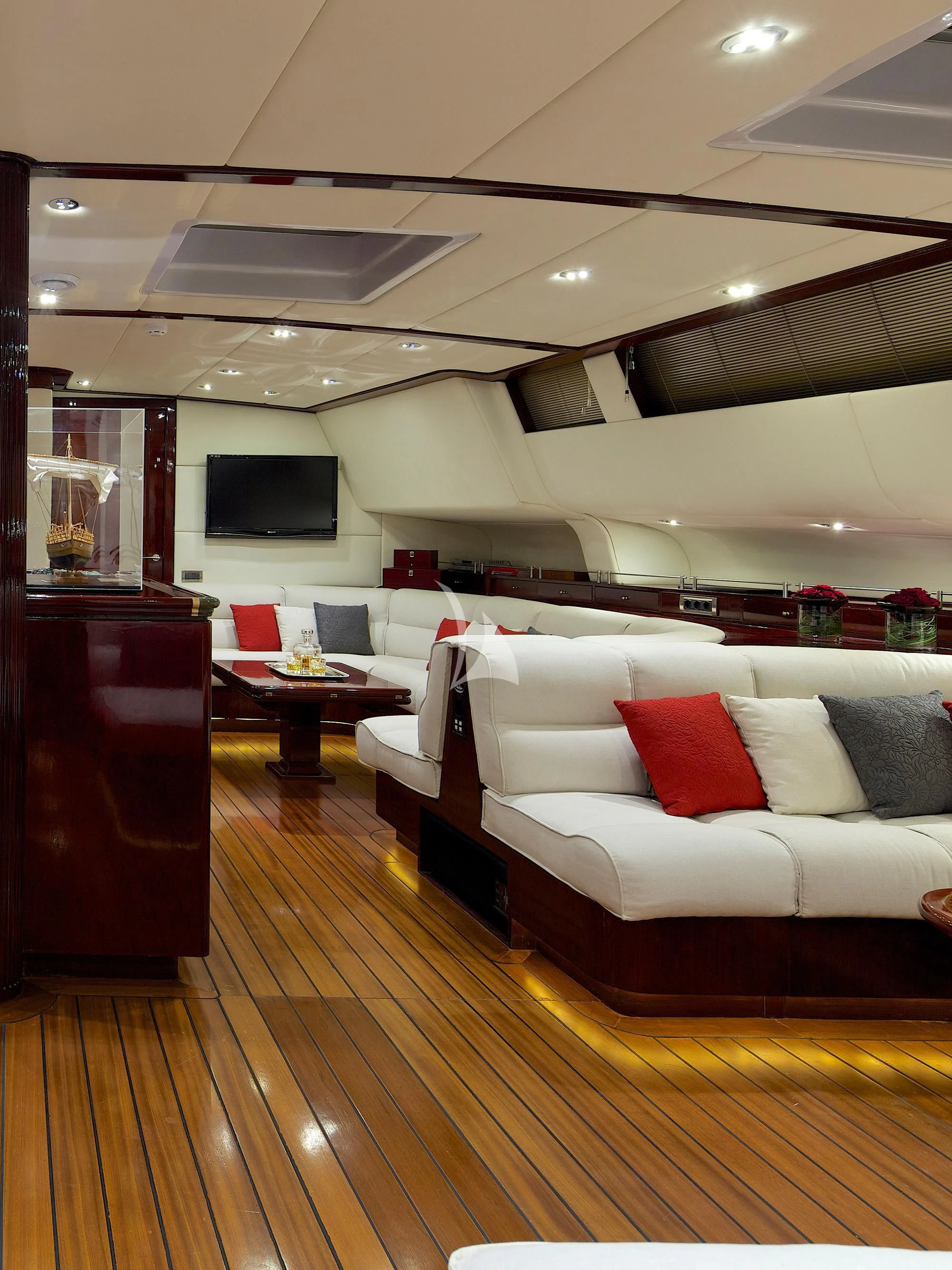 a living room with a wood floor aboard ALLURE A Yacht for Sale
