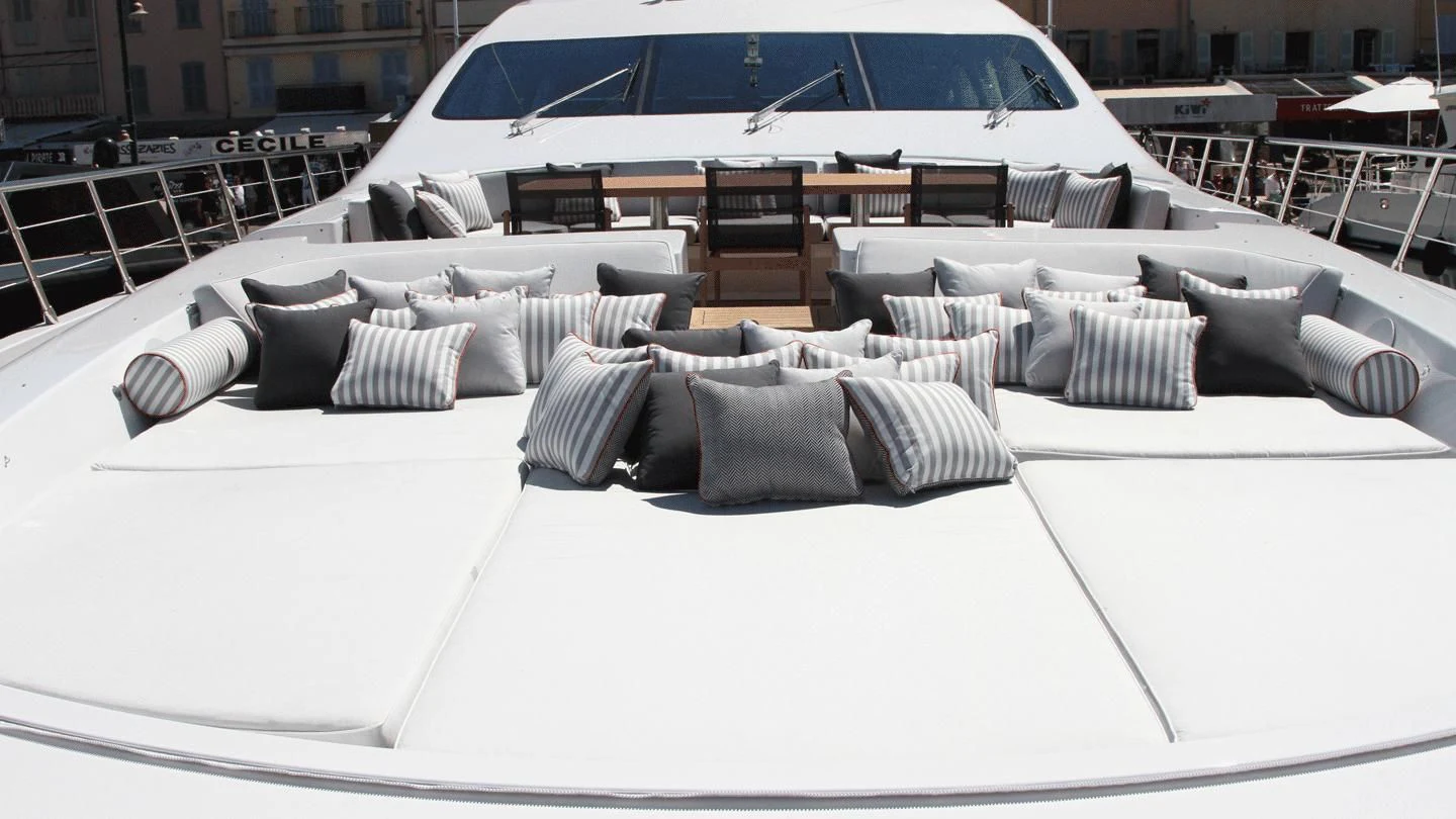 a large white bed with pillows aboard ALLURE A Yacht for Sale