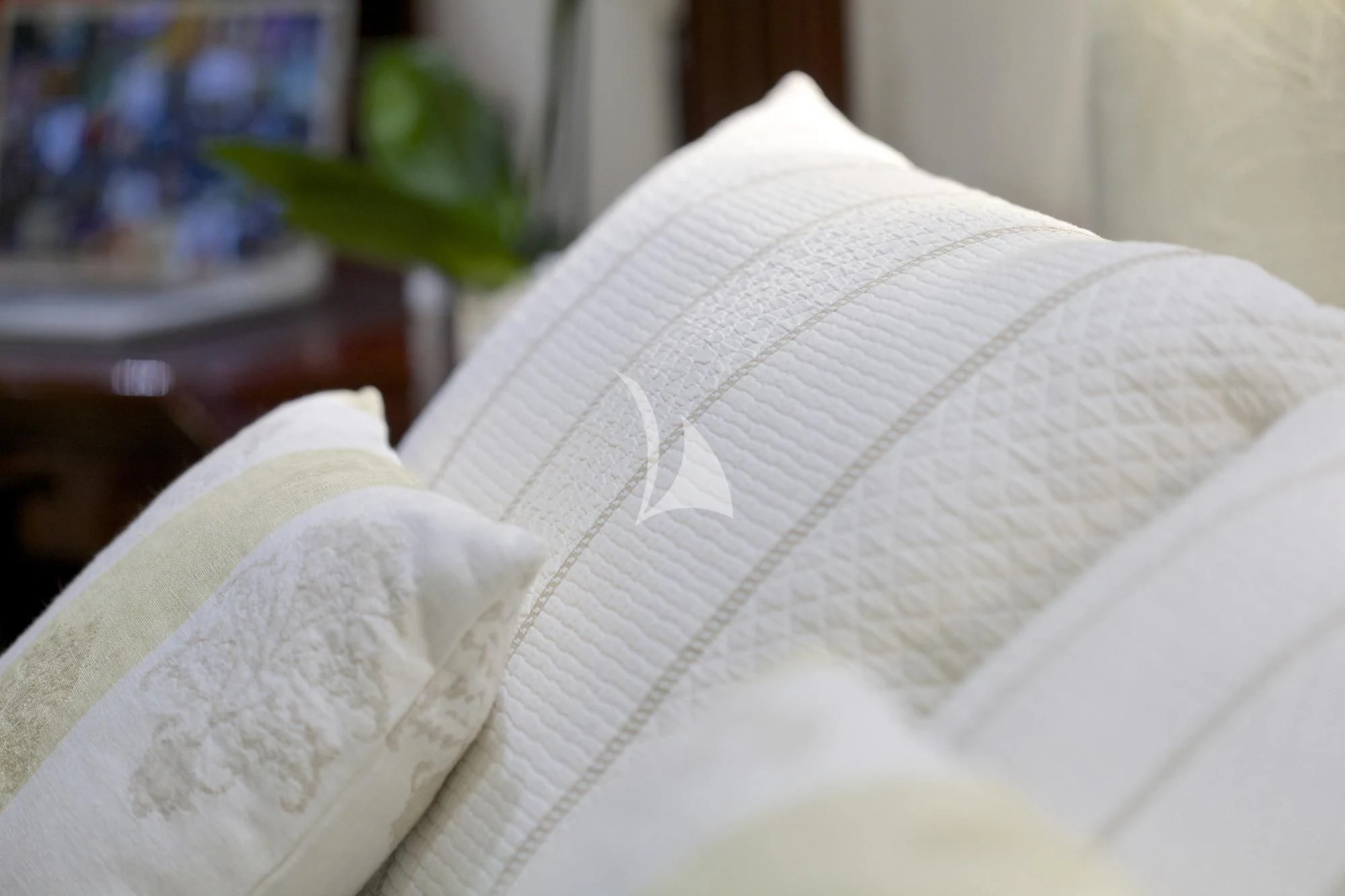 a white flower on a white pillow aboard ALLURE A Yacht for Sale