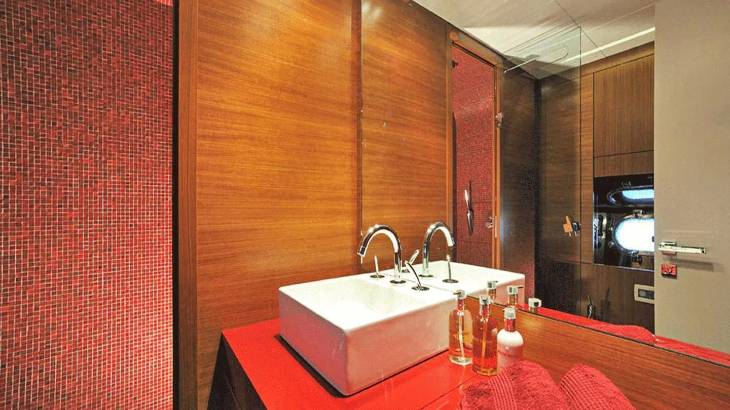 a bathroom with red walls aboard ALLURE A Yacht for Sale