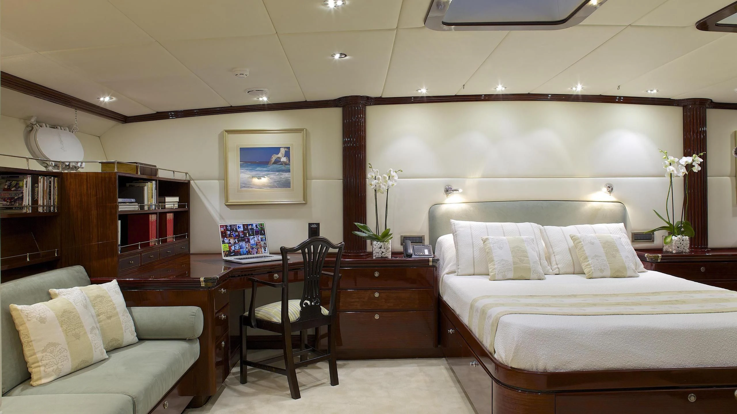 a bedroom with a bed and a desk aboard ALLURE A Yacht for Sale