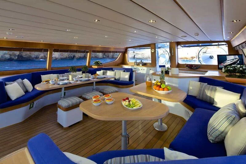 a room with a table and chairs aboard ALLURE A Yacht for Sale
