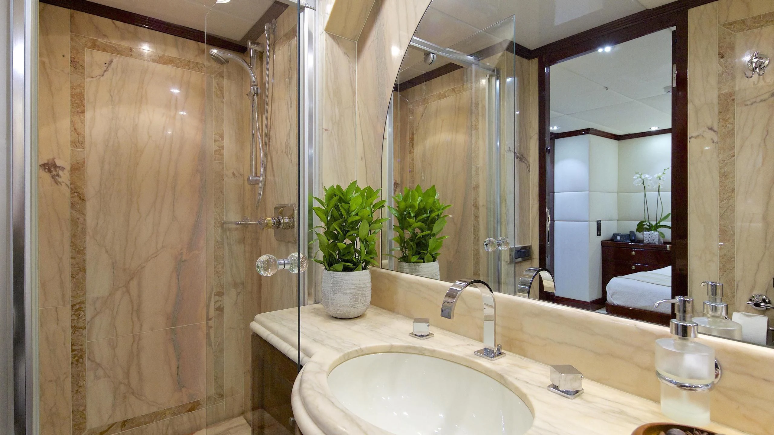 a bathroom with a large mirror aboard ALLURE A Yacht for Sale