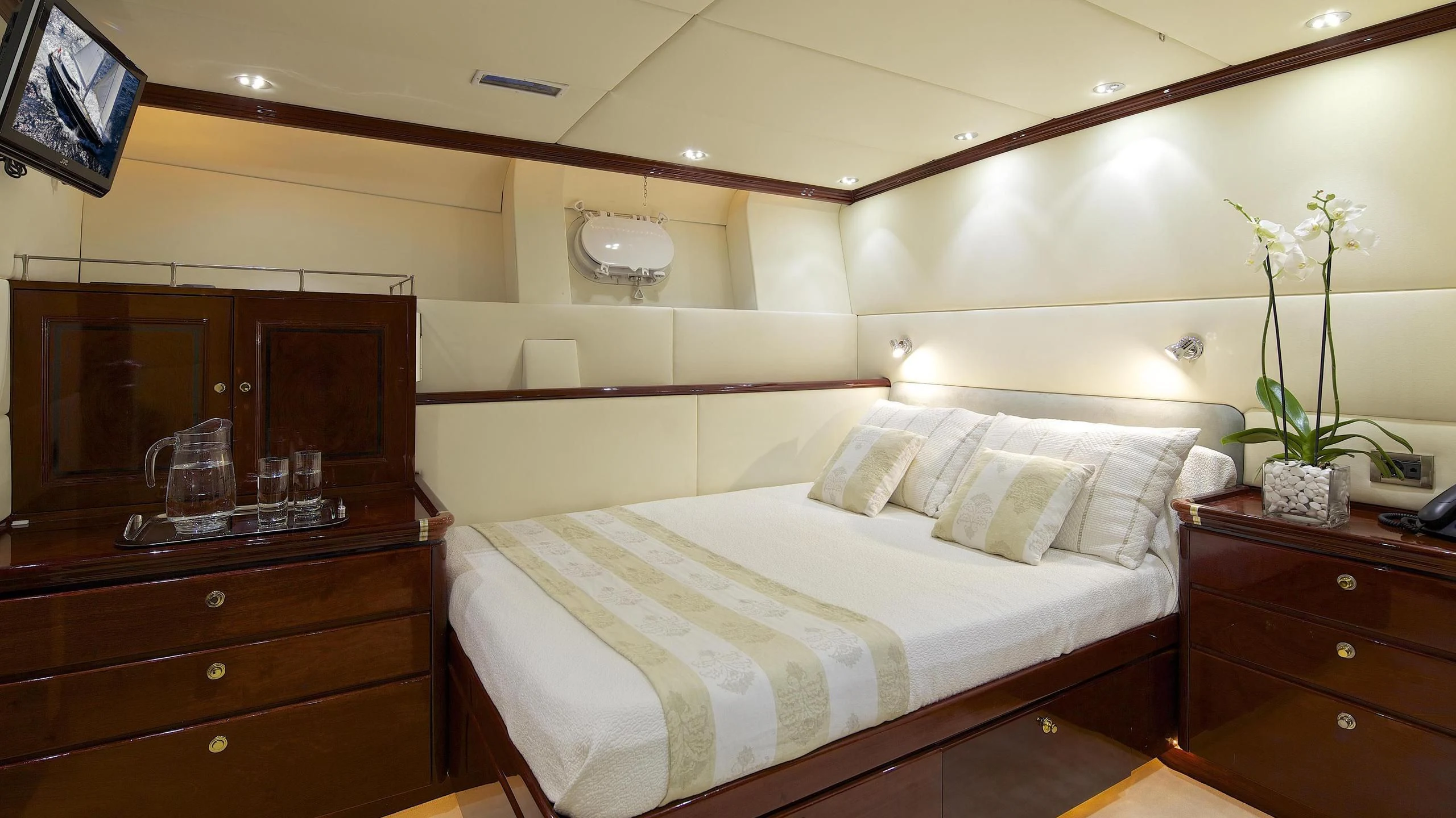 a bed with white sheets and pillows aboard ALLURE A Yacht for Sale