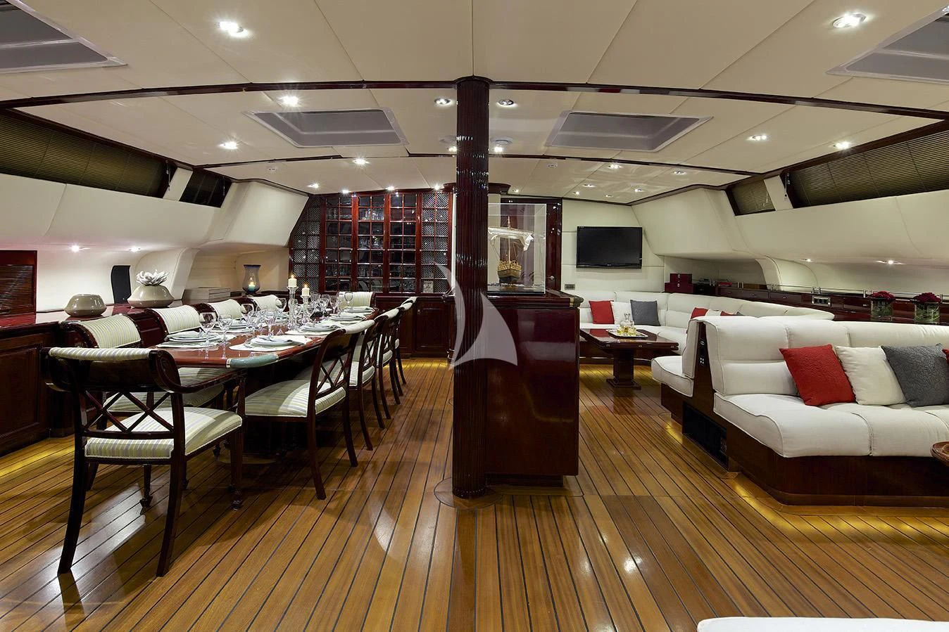 a room with tables and chairs aboard ALLURE A Yacht for Sale