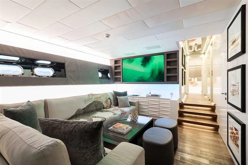 a living room with a large tv aboard ALLURE A Yacht for Sale