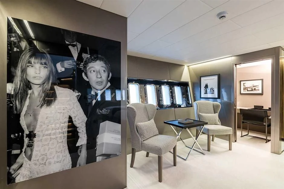 Serge Gainsbourg and woman in a room aboard ALLURE A Yacht for Sale