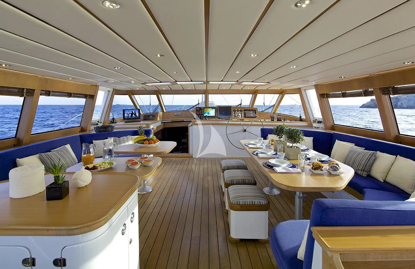a room with tables and chairs aboard ALLURE A Yacht for Sale