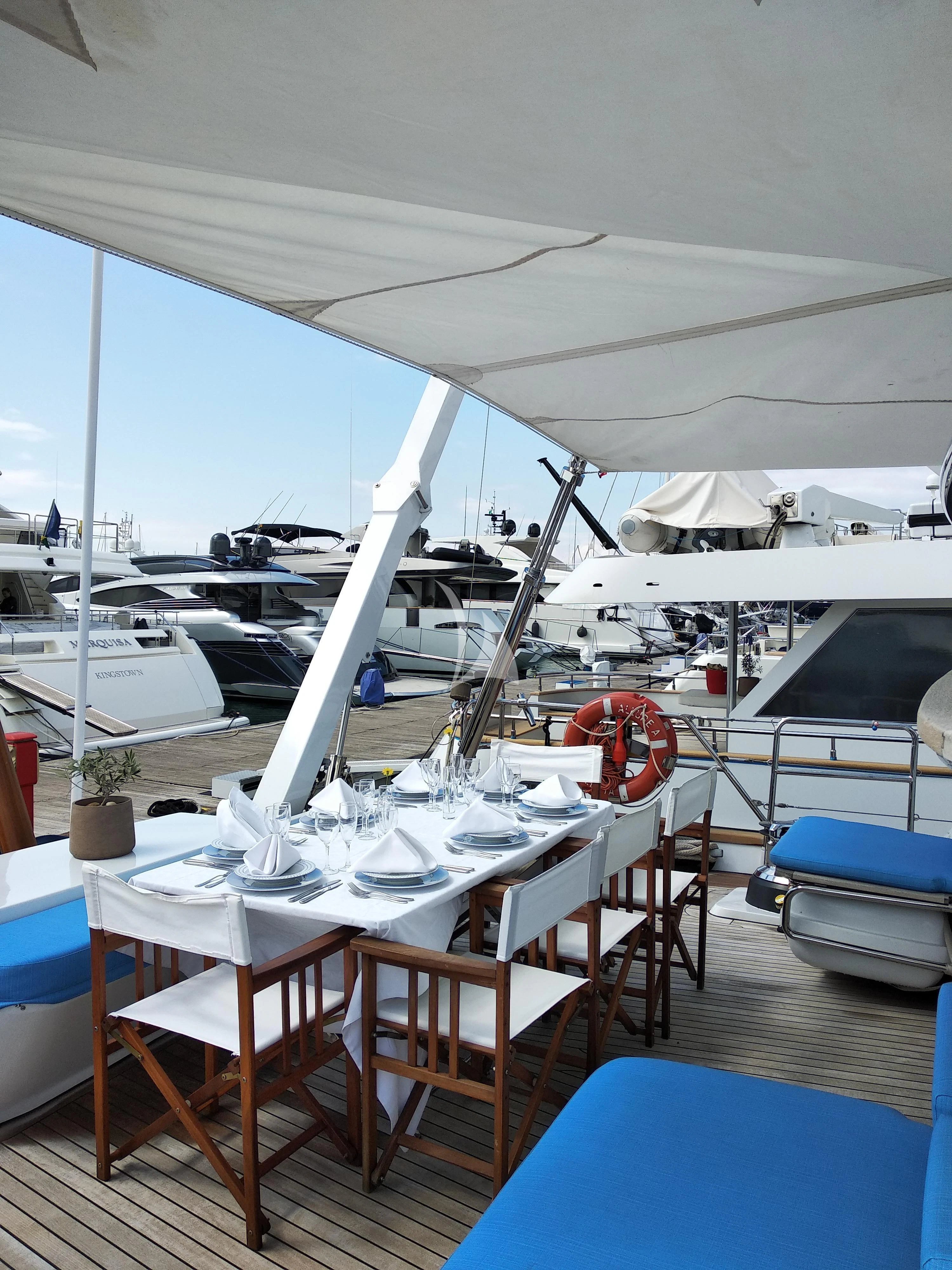 a table set for a dinner aboard ALLURE A Yacht for Sale