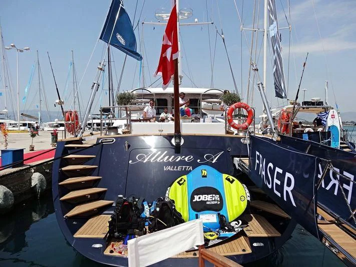 a boat with flags on it aboard ALLURE A Yacht for Sale