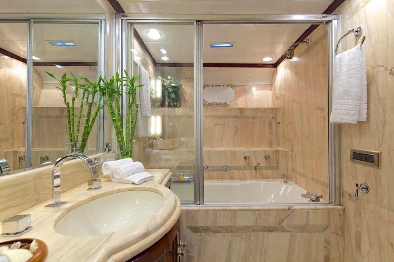 a bathroom with a tub sink and shower aboard ALLURE A Yacht for Sale
