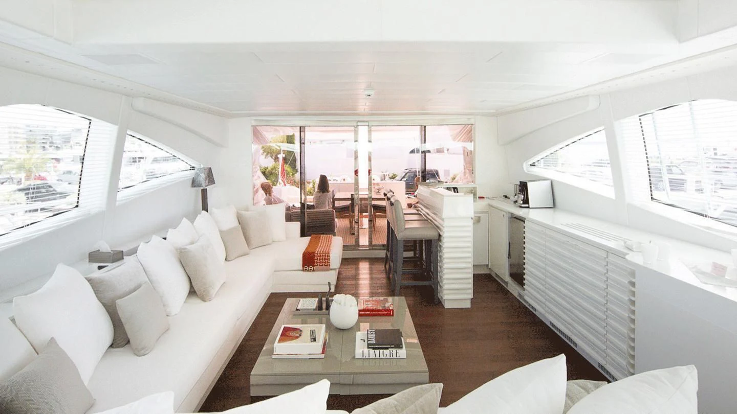 a living room with a large window aboard ALLURE A Yacht for Sale