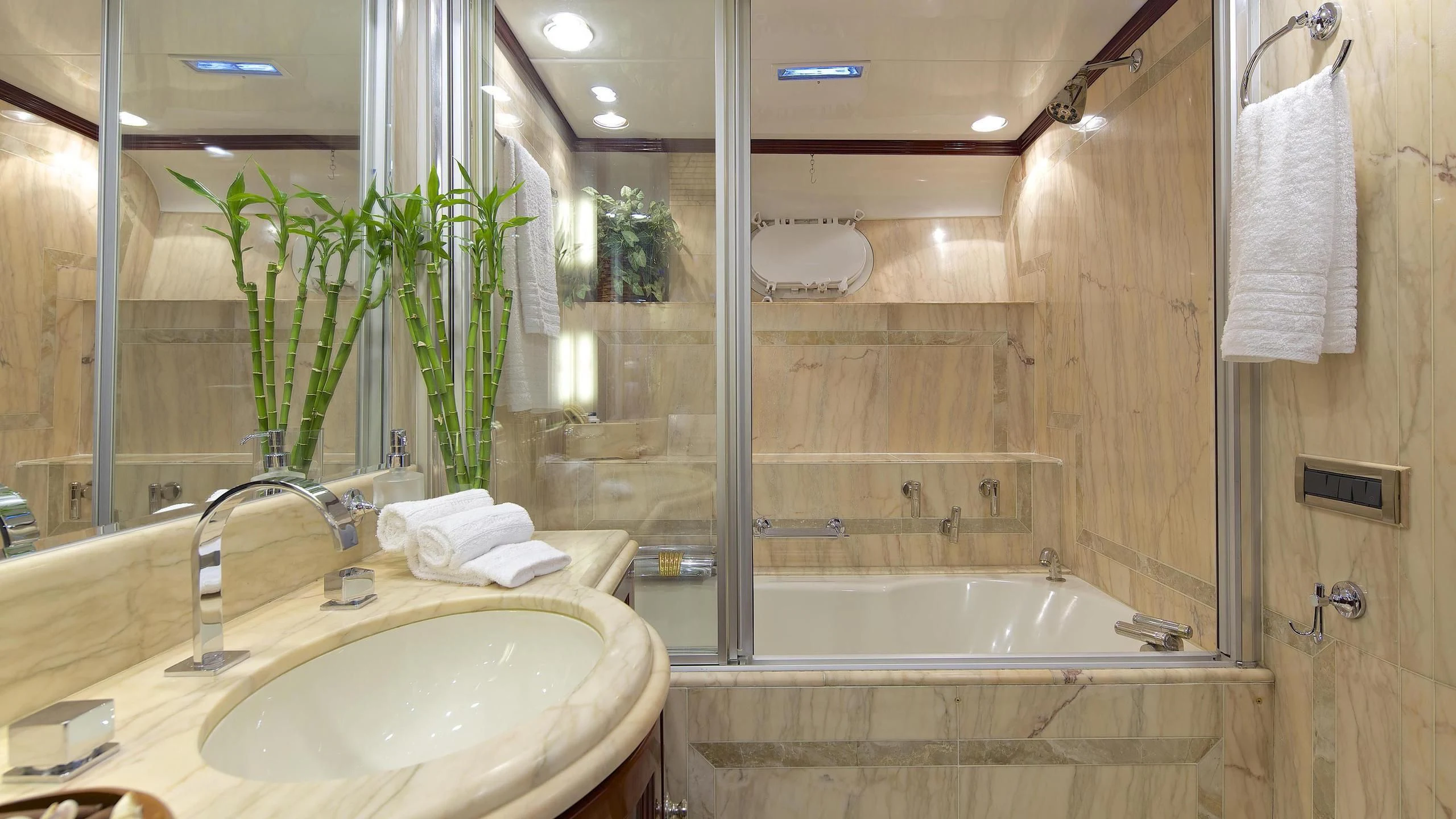 a bathroom with a tub sink and a sink aboard ALLURE A Yacht for Sale