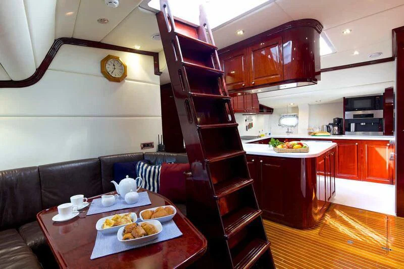 a kitchen with a ladder aboard ALLURE A Yacht for Sale