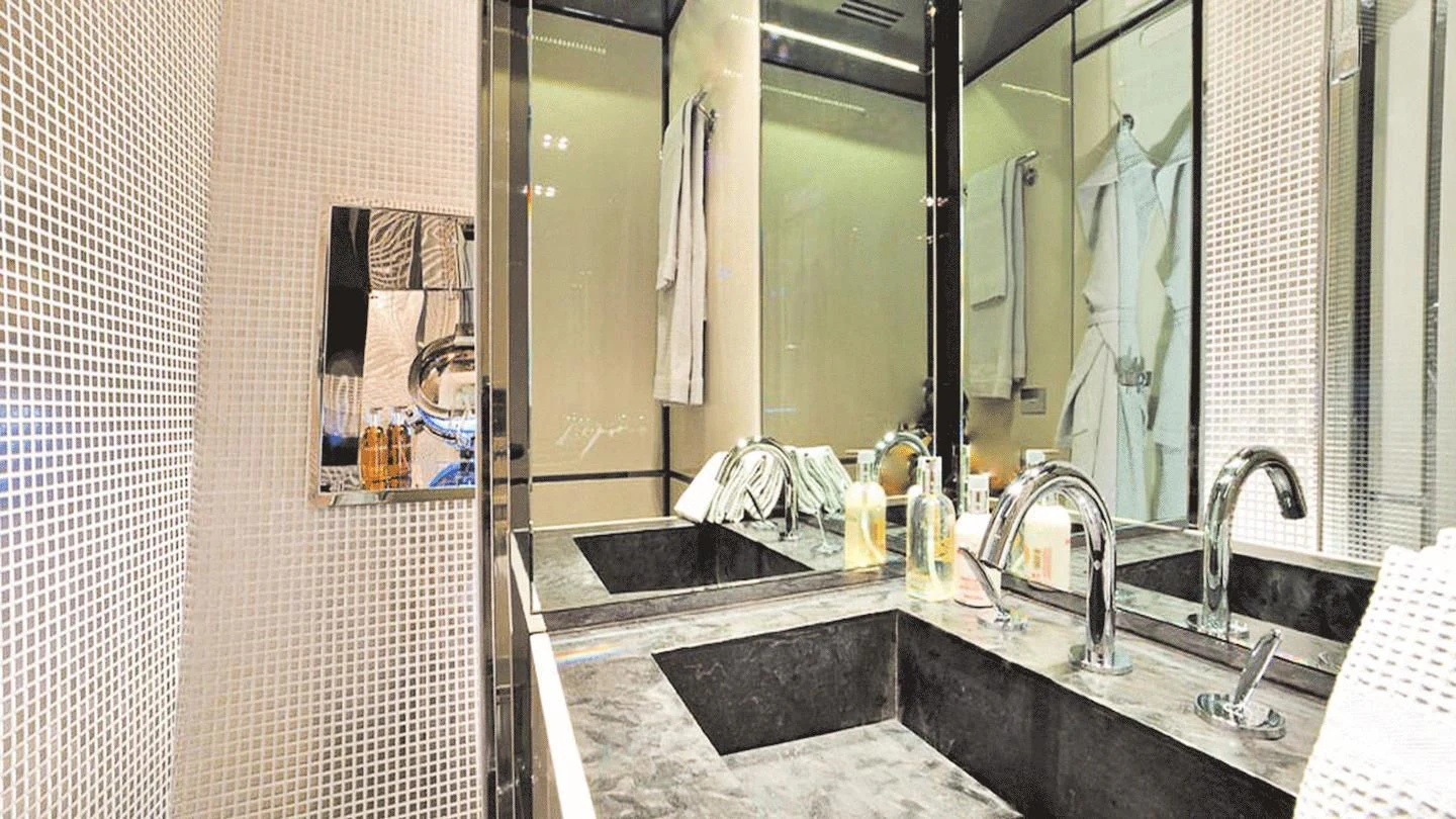 a bathroom with a large mirror aboard ALLURE A Yacht for Sale