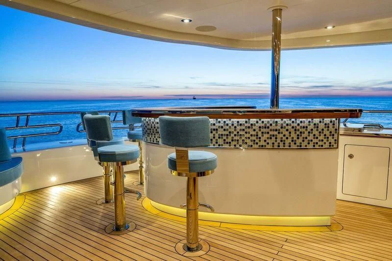 a room with a table and chairs aboard VIATORIS Yacht for Sale