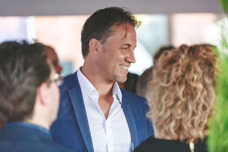 a man smiling at a woman aboard VIATORIS Yacht for Sale