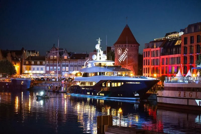 a large boat in a harbor aboard VIATORIS Yacht for Sale