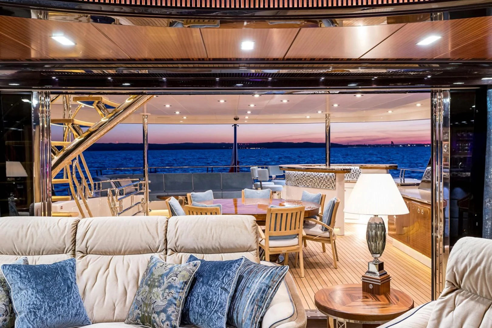 a room with a couch and a table and chairs aboard VIATORIS Yacht for Sale