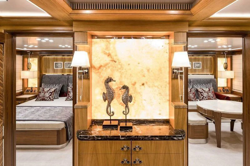 a large room with a painting on the wall aboard VIATORIS Yacht for Sale