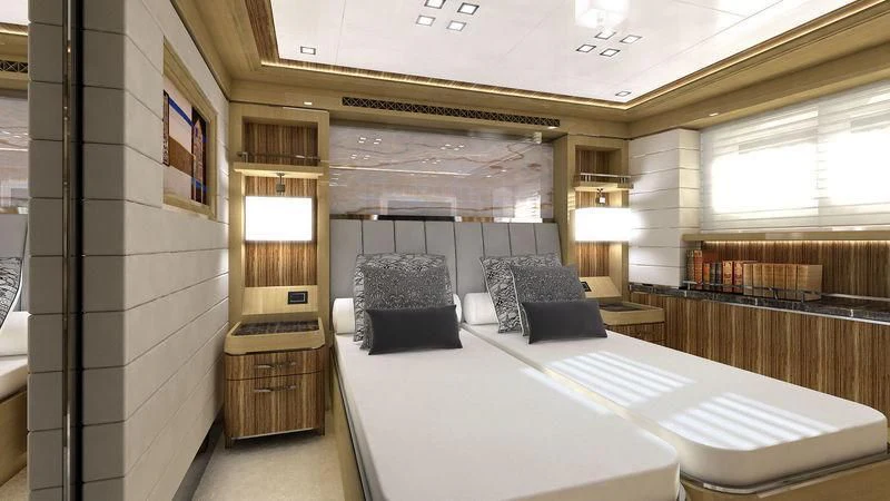 a room with a bed and a couch aboard VIATORIS Yacht for Sale