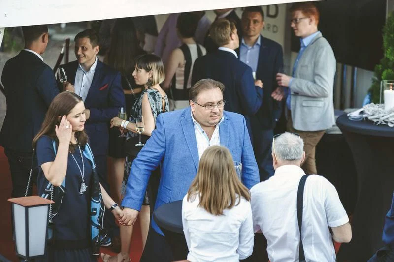 a group of people standing in a room aboard VIATORIS Yacht for Sale