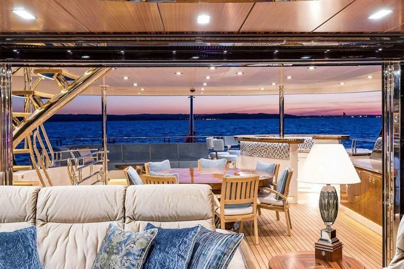 a room with a couch and a table and chairs aboard VIATORIS Yacht for Sale