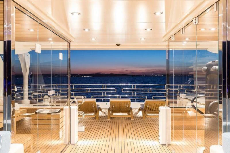 a large room with chairs and tables aboard VIATORIS Yacht for Sale