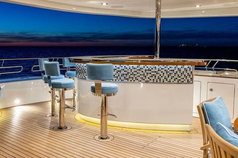 a room with a table and chairs aboard VIATORIS Yacht for Sale